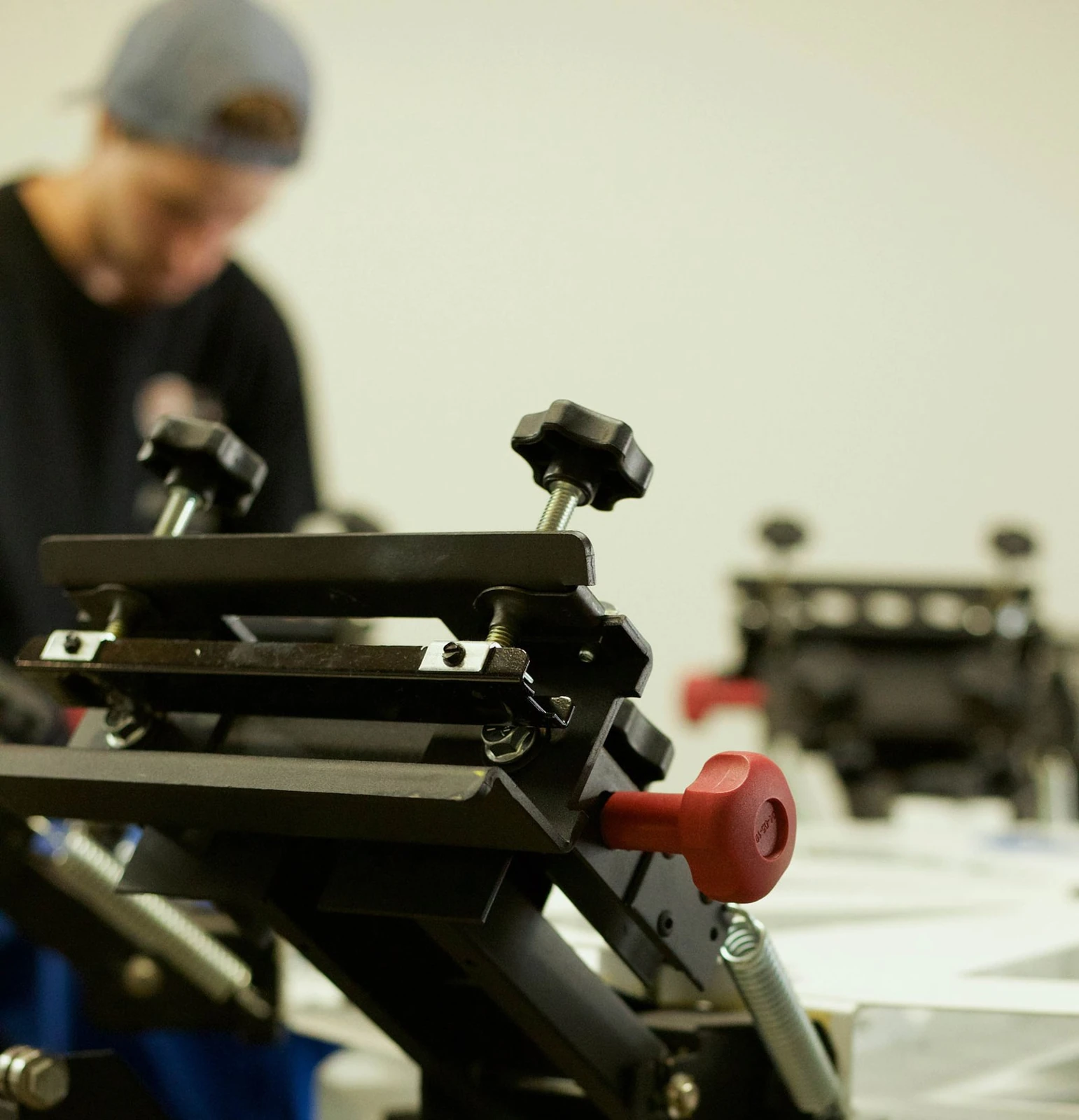 Grant working at the Grizzly Graphics press