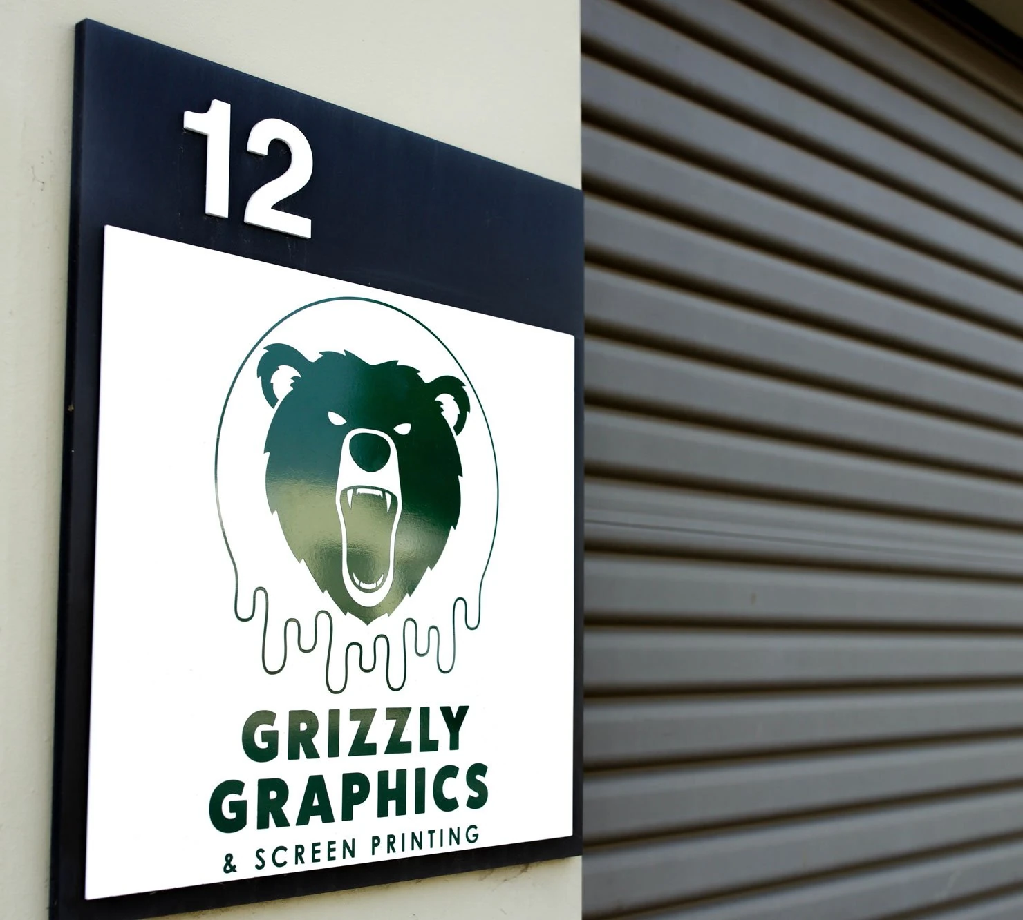 Grizzly Graphics storefront sign from the shop portfolio